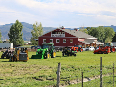 Tractors and farm equipment displayed in the field at Heber Valley Cheese in Midway, Utah.